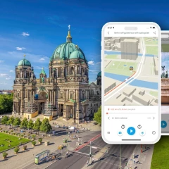 Promotion picture by TouringBee. It is a bird's eye view of the Berlin Cathedral and the Lustgarten. In the right edge of the picture you can see cell phone mockups, on which the City guide is presented.