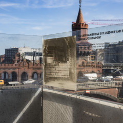 The Wall Museum View from The Wall Museum towards Oberbaum Bridge. A glass information panel stands facing Oberbaum Bridge.