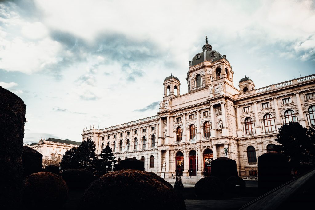 Kunsthistorisches Museum Vienna, exterior view, green bushes are in the foreground