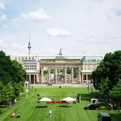 Brandenburg Gate, European Football Championship 2024, green turf on the street, TV tower in the background