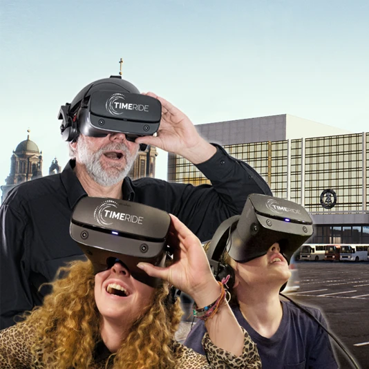 3 people with VR glasses from TimeRide Berlin in front of the Palast der Republik
