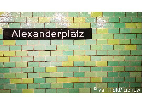 Alexanderplatz, subway station, green tiles, black Alexanderplatz sign