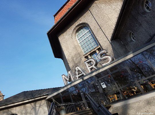 Silent Green neighborhood, lettering Mars stands at the entrance of a gray house