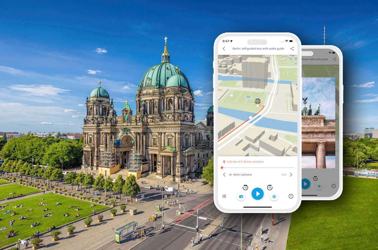 The Berlin Cathedral from above in summer. A smartphone with the TouringBee app open has been artificially added to the image