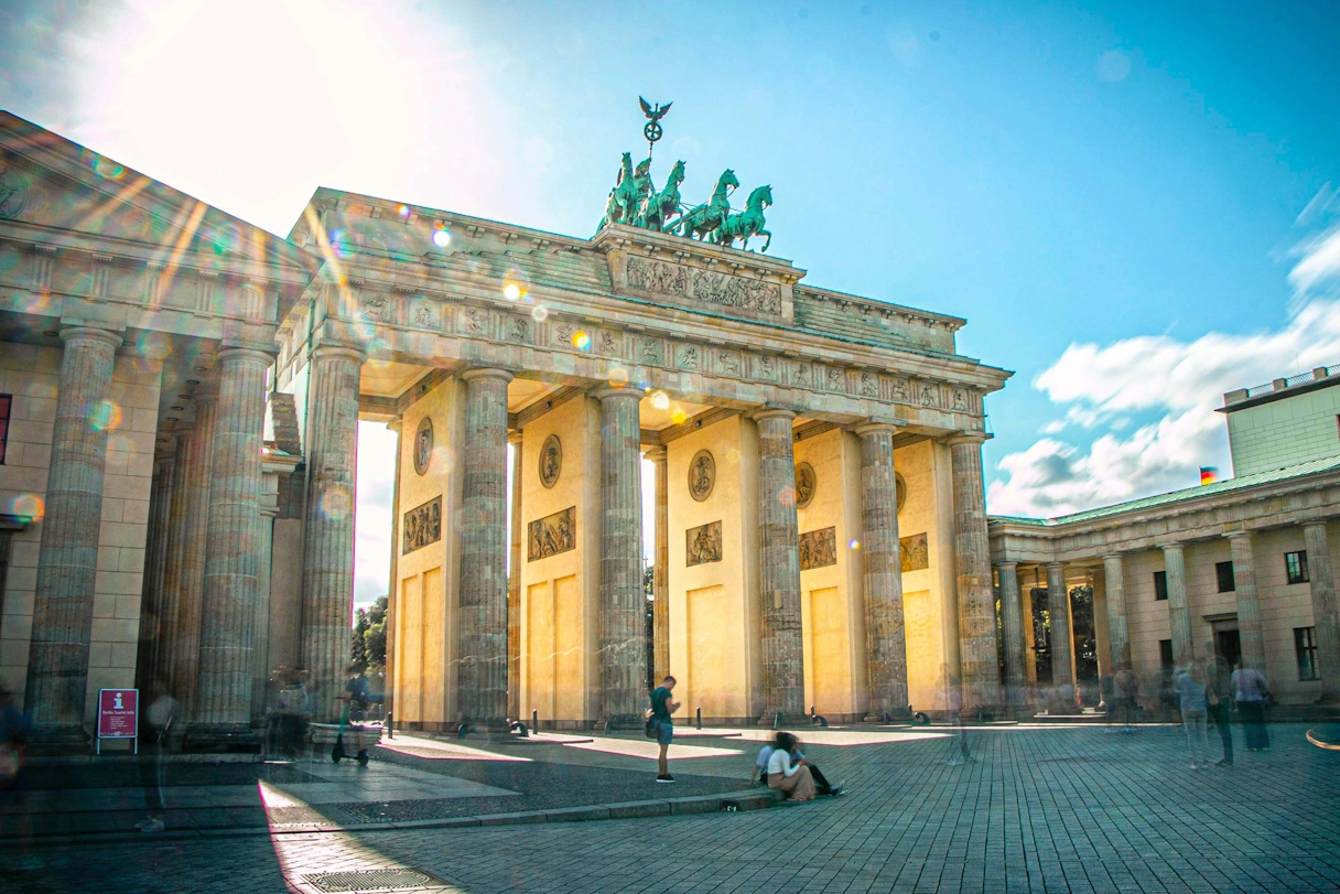 Brandenburg Gate in Berlin. The sun is shining and there are hardly any people to be seen.