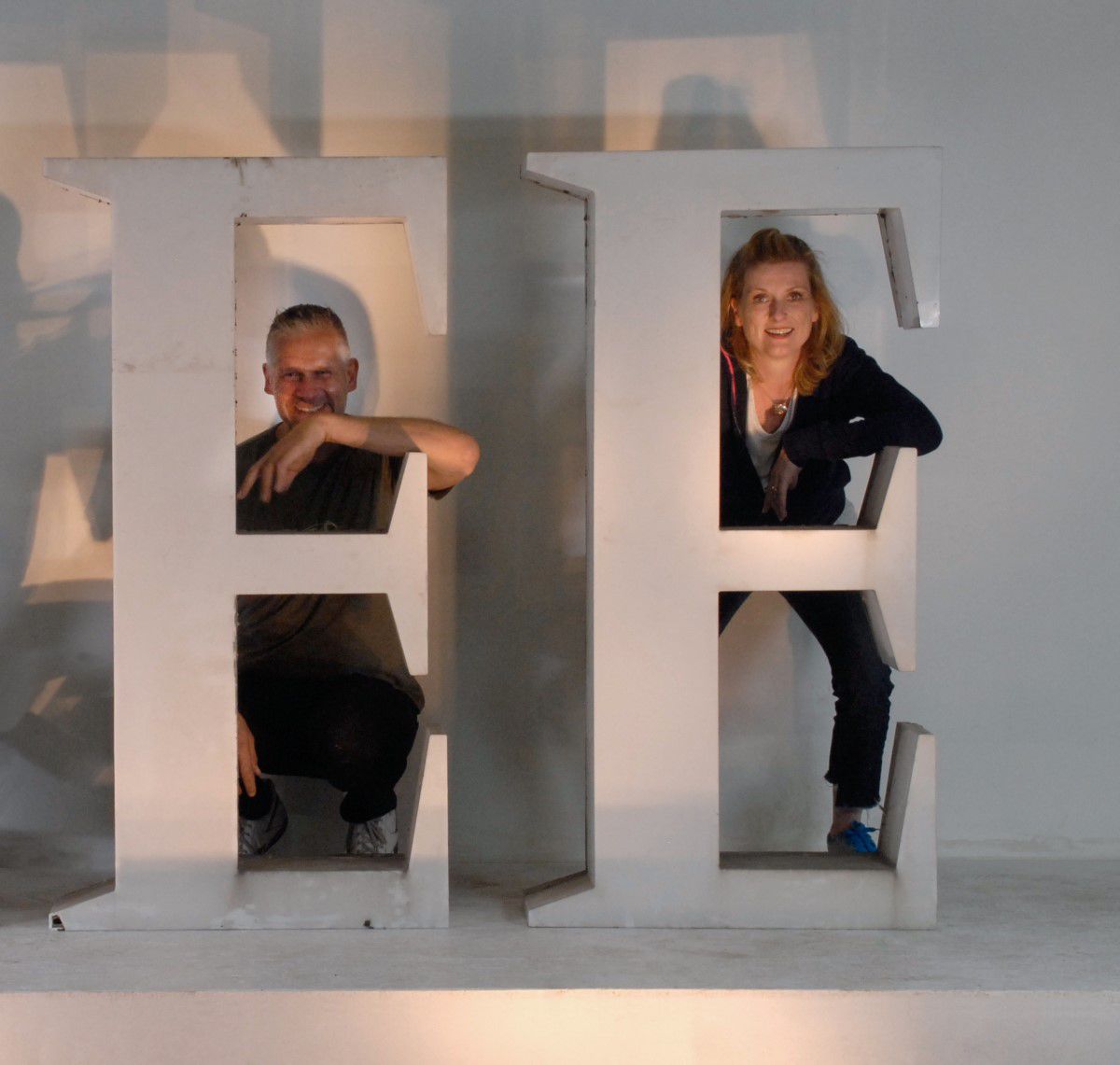 Buchstabenmuseum Berlin, Museum of Letters, Till Kaposty-Bliss and Barbara Dechant behind two big letters