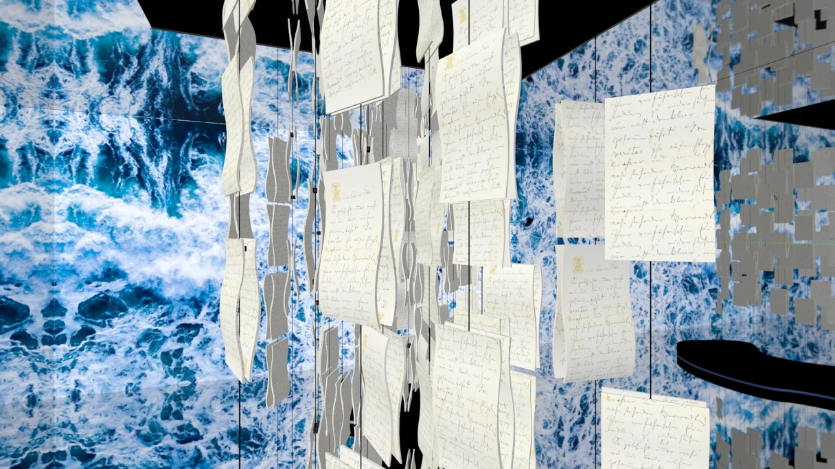 Exhibition room in the Johann Strauss Museum. Various letters hang on strings from the ceiling. In the background is a blue wall on which various films are played.