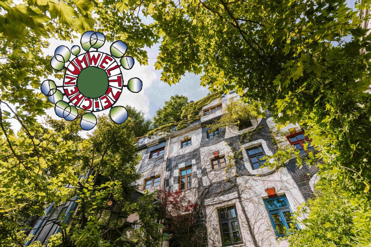 KunstHausWien, Exterior view, green overgrowth, eco-label on the left edge of the picture