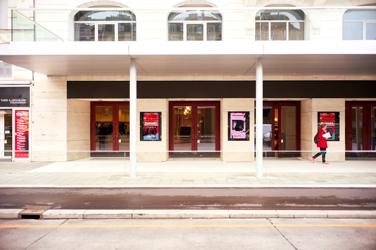 View of the entrance area of the Theater an der Wien by day. Empty street, only one person can be seen on the right edge of the picture.