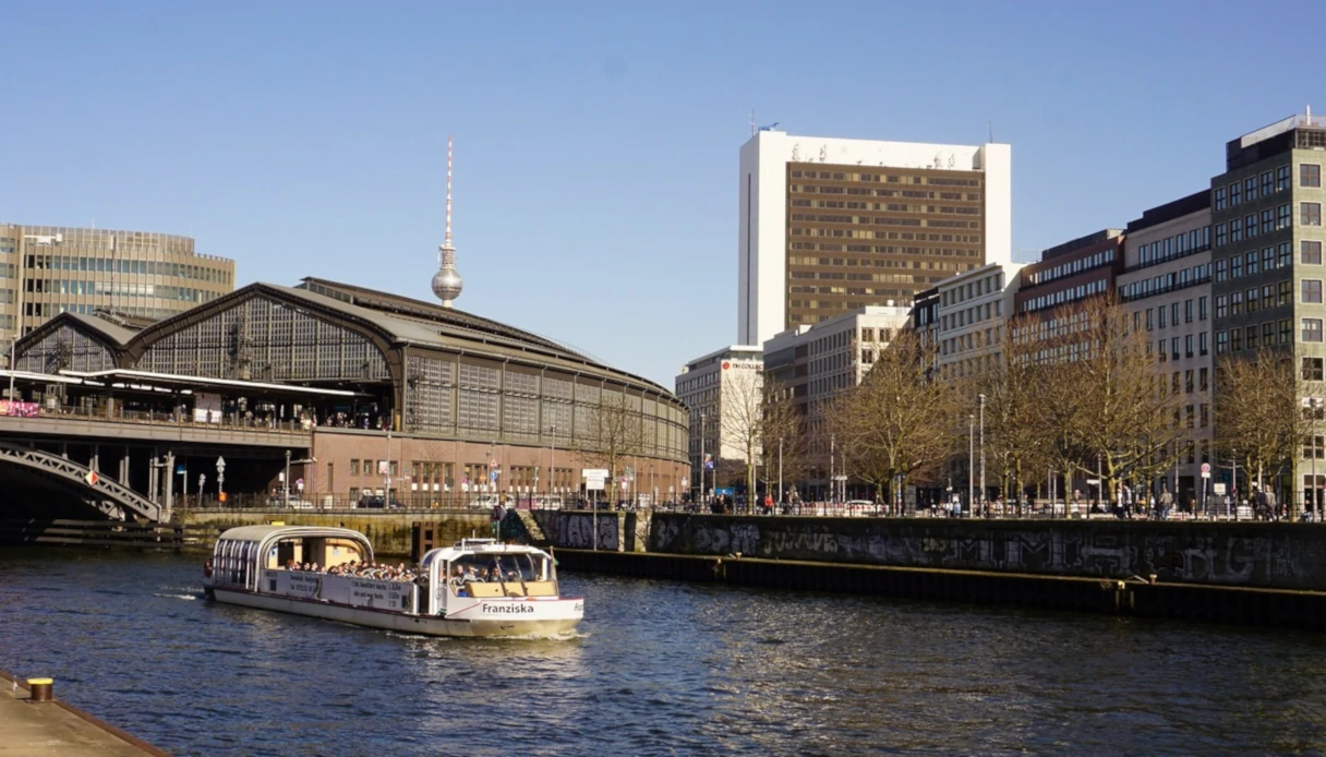 Reederei Hadynski, Berlin, view of Friedrichstrasse with the train station and commercial center in the background, sunny day