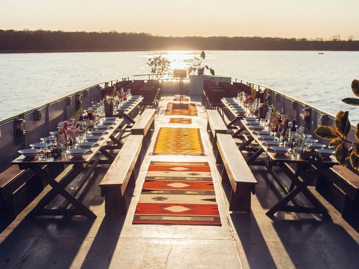 Reederei Riedel, ship Schöneberg is prepared for an event, sunset, tables are set on the right and left, carpets lie in the middle