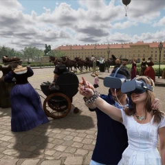 VR-Tours-Vienna, two visitors stand with VR glasses and point at something, digital historical overlays in the background