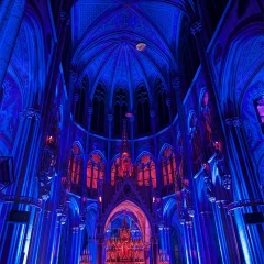 Light of Creation in the Votive Church. The church is illuminated blue and red inside.