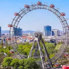 A view of the Vienna Giant Ferris Wheel in the Prater. The silhouette of Vienna can be seen in the background.